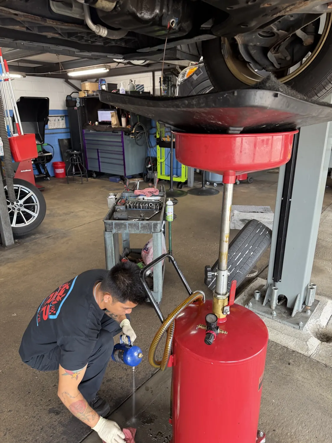 Oil and filter service on a lift at KRP Automotive Repair in Clifton, NJ