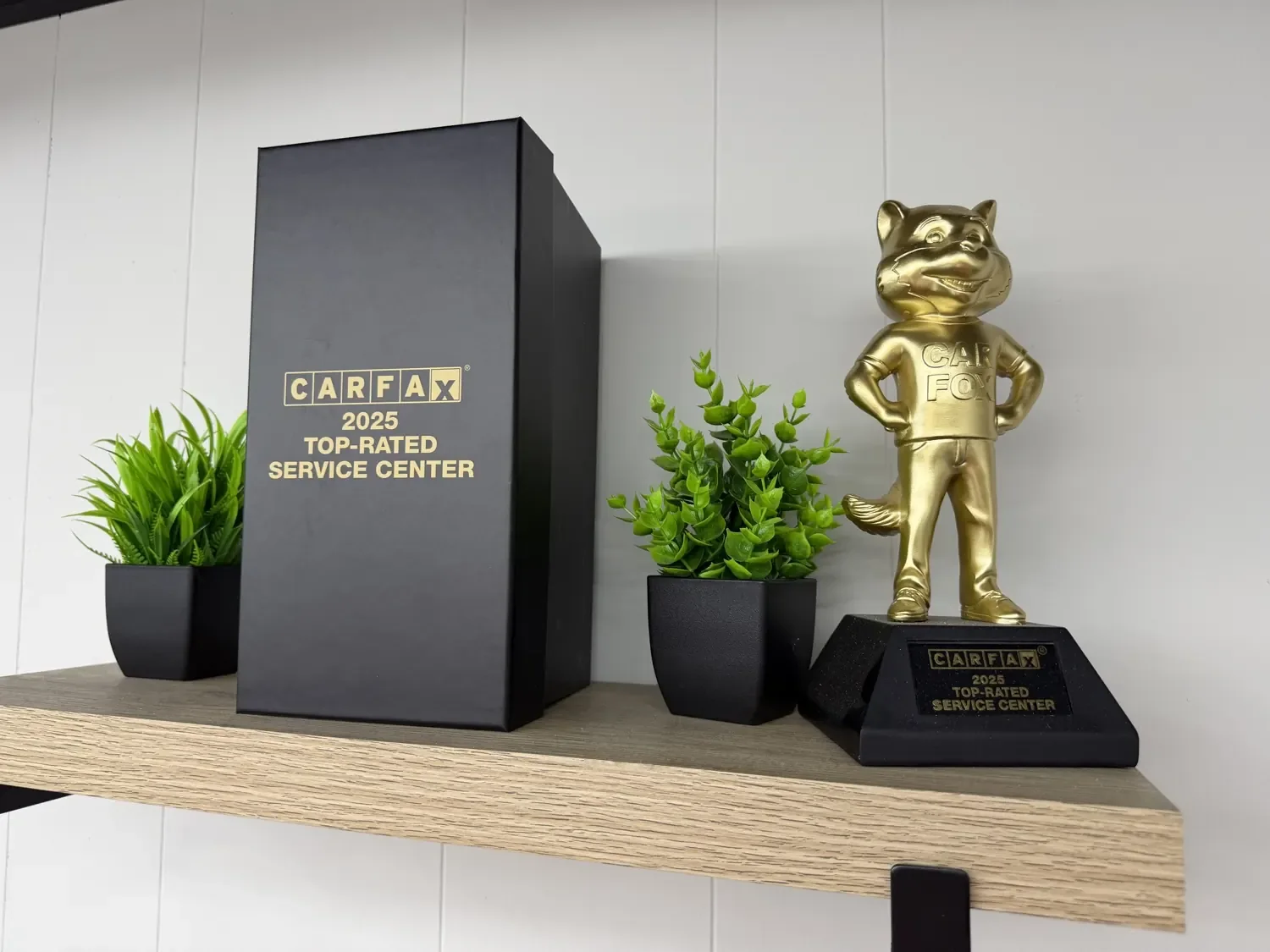 The Carfax 2025 Top-Rated Service Center award on the shelf in the KRP Automotive Franklin lobby